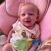 Makayla joined the competition — help win amazing prizes! baby, infant, smile, onesie, princess, pink, cushion, seat, pacifier, clothing, child, cute, happy, person, indoor, portrait, young, skin, face, babywear