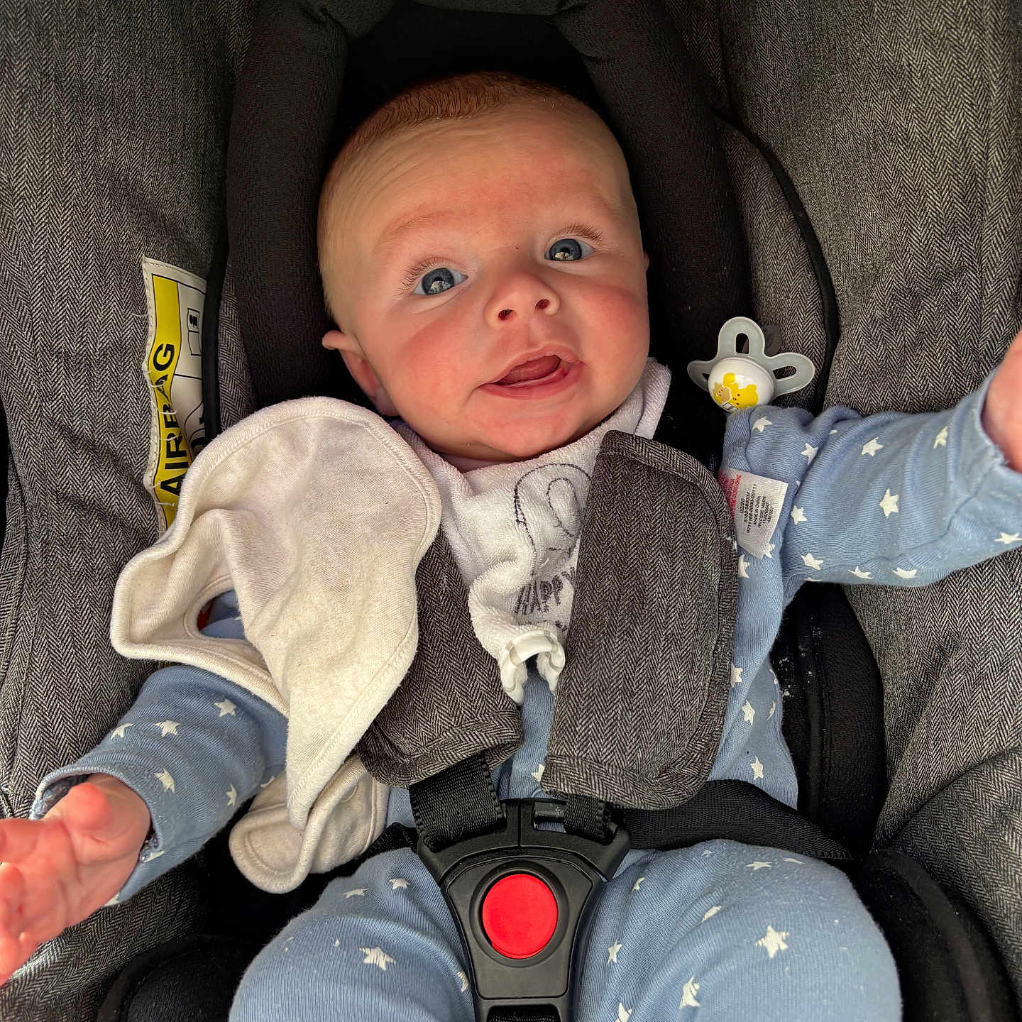 Kairon is registered to the contest to win money with this photo: baby, blanket, blue_pajamas, car_seat, child, clothing, cute, eyes, fabric, face, hands, indoor, infant, infant_accessory, pacifier, portrait, safety, seat_belt, smiling, stars_pattern