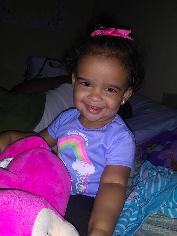 Kaleeah is registered to the contest to win money with this photo: arm, baby, beauty, cheek, child, eye, face, forehead, fun, head, human, iris, joy, lip, people, person, pink, purple, sitting, skin