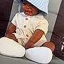 Camryn joined the competition — help win amazing prizes! baby, child, smiling, hat, bucket_hat, beige_clothing, buttons, seated, cushion, seat, happy, infant, cute, indoors, portrait, young_child, skin, face, white_shoes, shorts