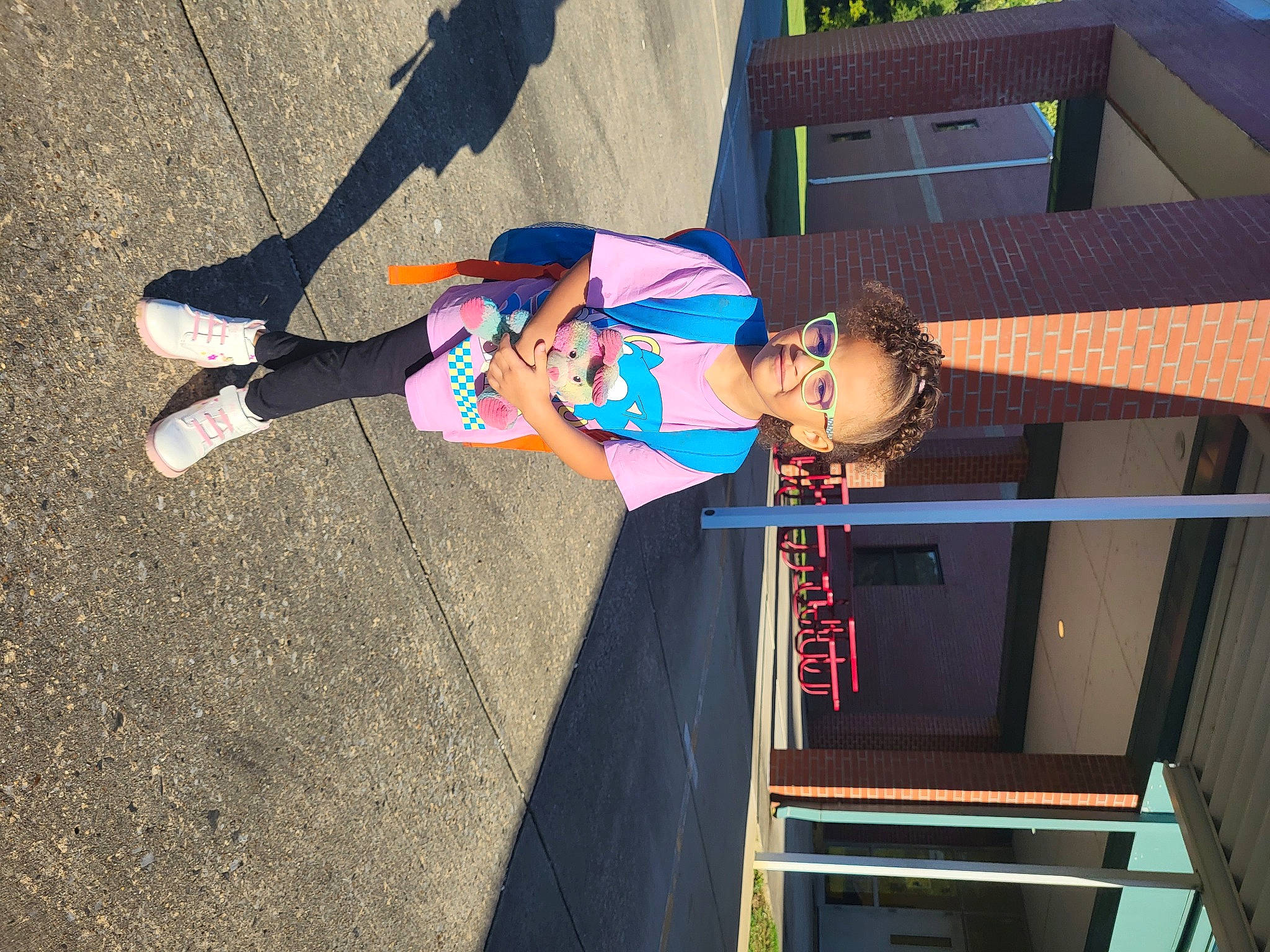 Marlee is registered to the contest to win money with this photo: child, city, electric_blue, fun, human_leg, joy, leisure, person, recreation, shadow, smile, toddler, tree, wood