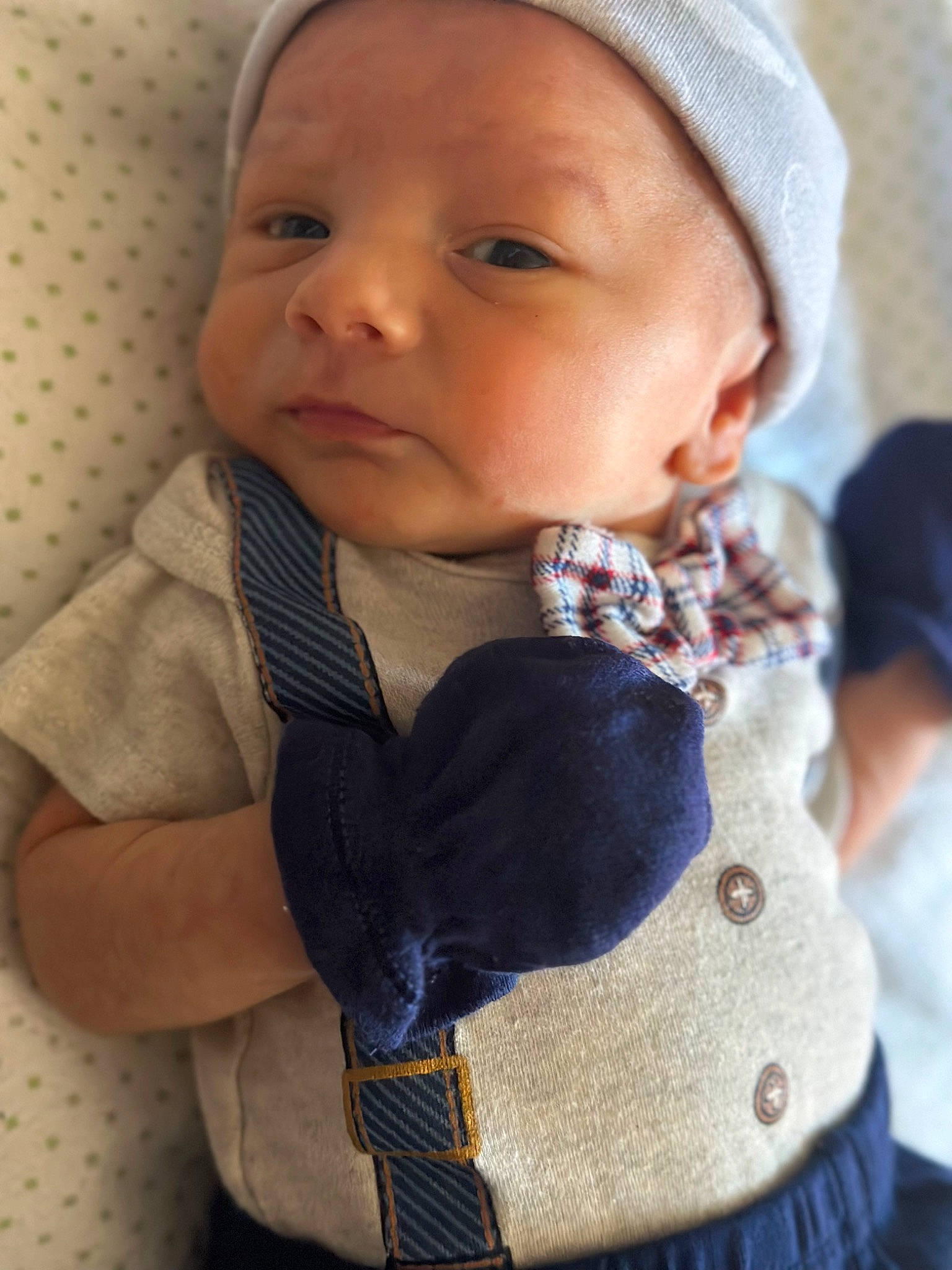 Noah is registered to the contest to win money with this photo: baby, baby_toddler_clothing, cap, cheek, child, collar, comfort, electric_blue, fashion_accessory, lip, neck, nose, pattern, person, plaid, skin, sleeve, tartan, textile, toddler