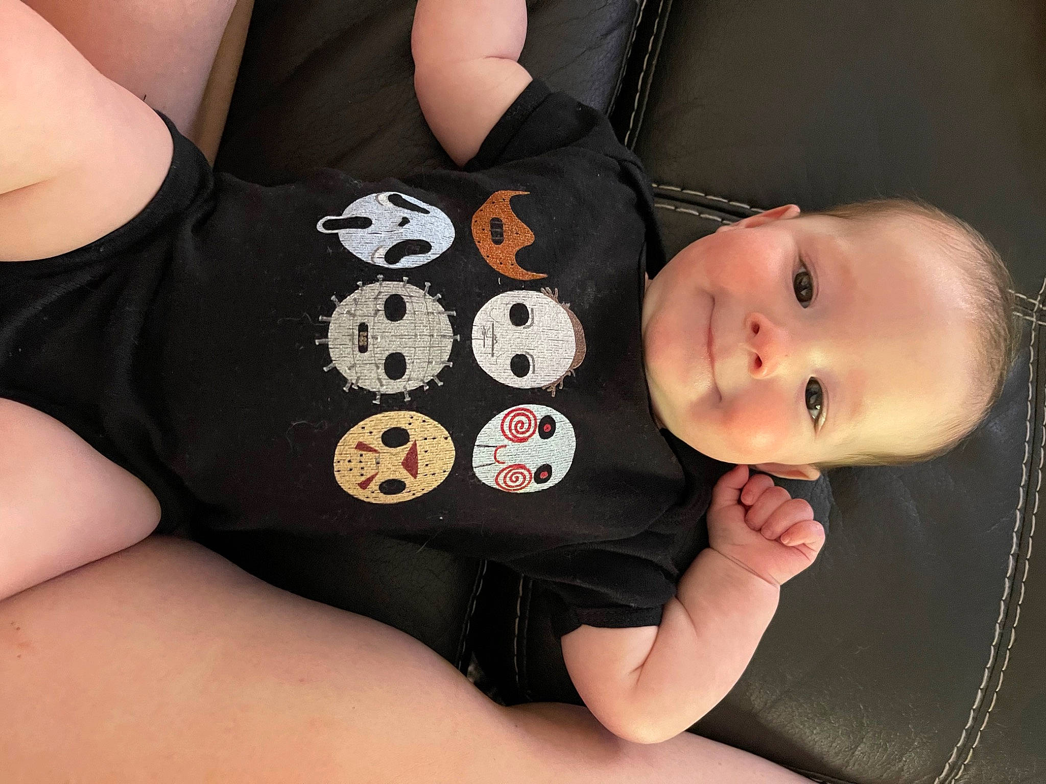 Remington is registered to the contest to win money with this photo: baby, baby_toddler_clothing, cheek, chest, child, collar, comfort, elbow, facial_expression, finger, human_leg, knee, neck, pattern, person, sitting, skin, sleeve, thigh, toddler