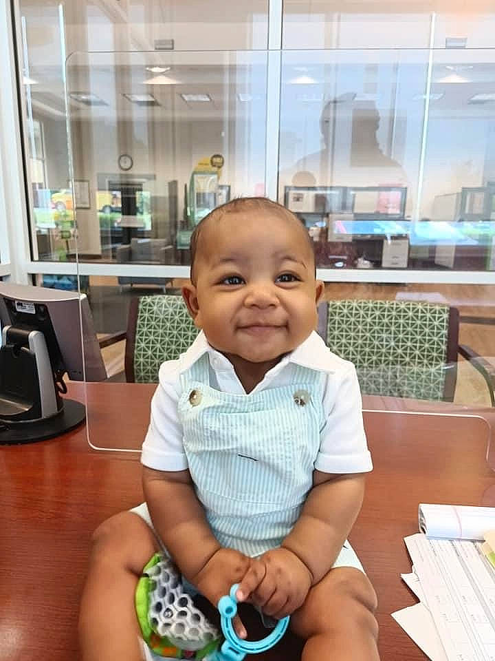 Kruz joined the competition — help win amazing prizes! baby, baby_toddler_clothing, backpack, bag, chair, child, desk, flooring, fun, happy, joy, luggage_and_bags, person, room, sitting, skin, smile, t_shirt, table, thumb