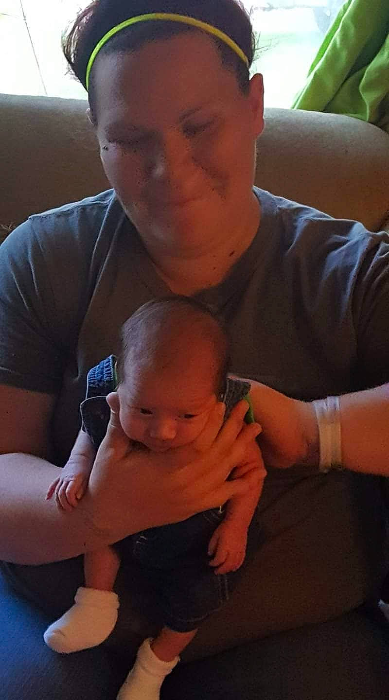 Jonathon Jr is registered to the contest to win money with this photo: arm, cheek, comfort, eye, face, facial_expression, finger, gesture, hairstyle, hand, joint, joy, lap, leg, mouth, muscle, nose, organ, person, shoulder