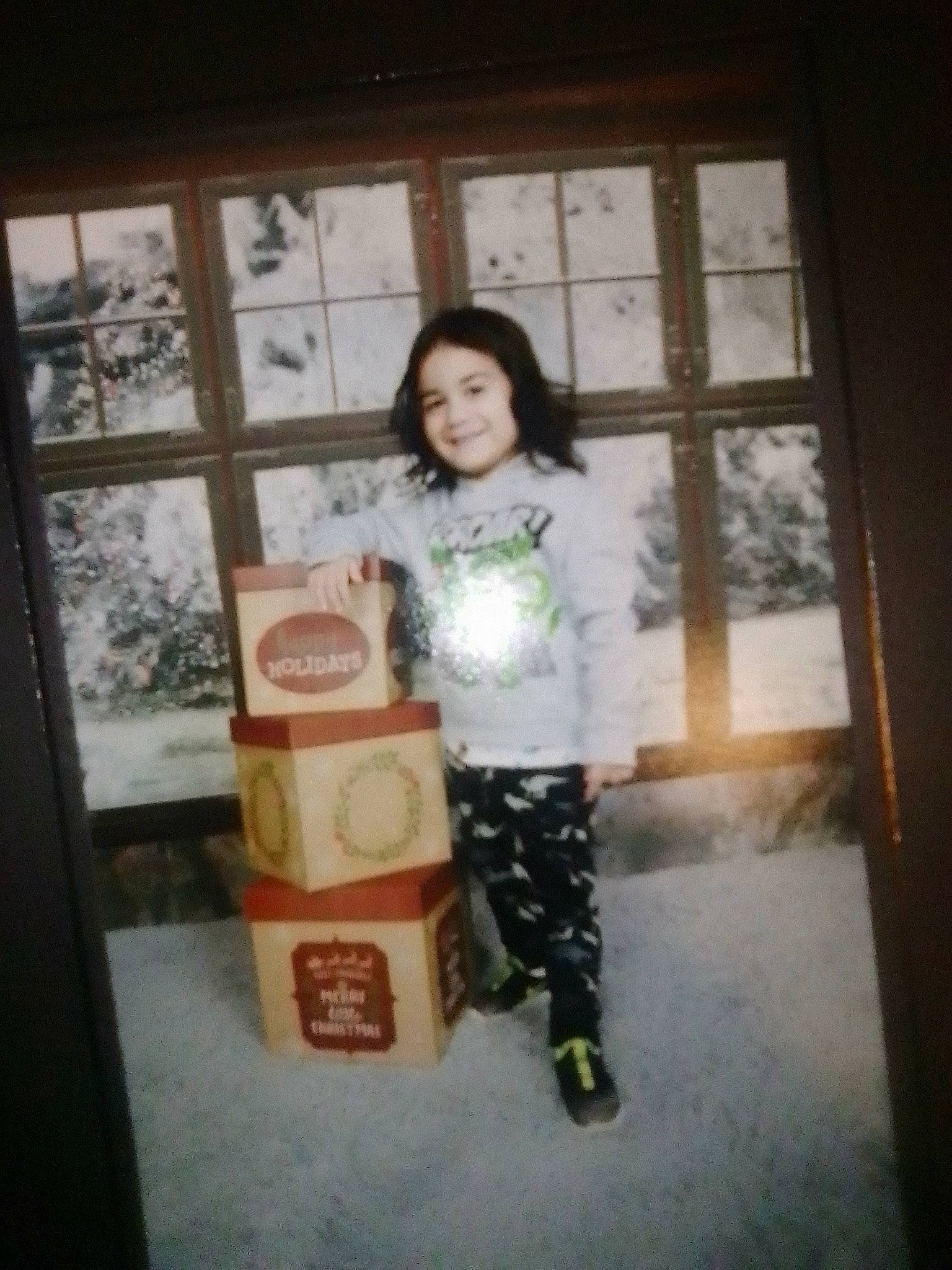 Jonathon Jr is registered to the contest to win money with this photo: boot, box, cardboard, child, flash_photography, fun, happy, hardwood, joy, knee, pattern, person, room, shorts, sitting, sleeve, smile, t_shirt, tints_and_shades, toddler