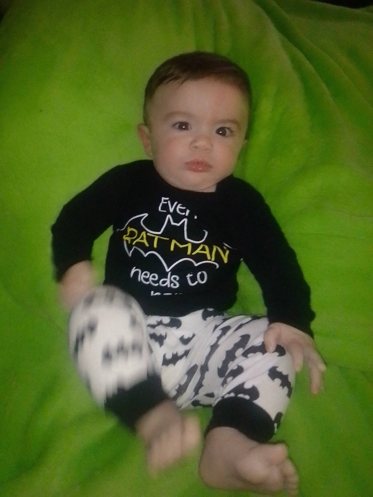 Kaiden is registered to the contest to win money with this photo: baby, baby_toddler_clothing, cheek, finger, flash_photography, fun, grass, happy, human_body, knee, leaf, mammal, pattern, person, shorts, sleeve, sock, t_shirt, thigh, toddler