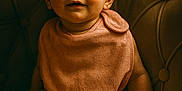 Elena a rejoint le concours — aidez-le/la à gagner de superbes lots ! baby, bib, chair, child, curious, cute, face, hands, indoors, infant, legs, plush_chair, portrait, sitting, skin, smile, soft_texture, toddler, warm_lighting, young