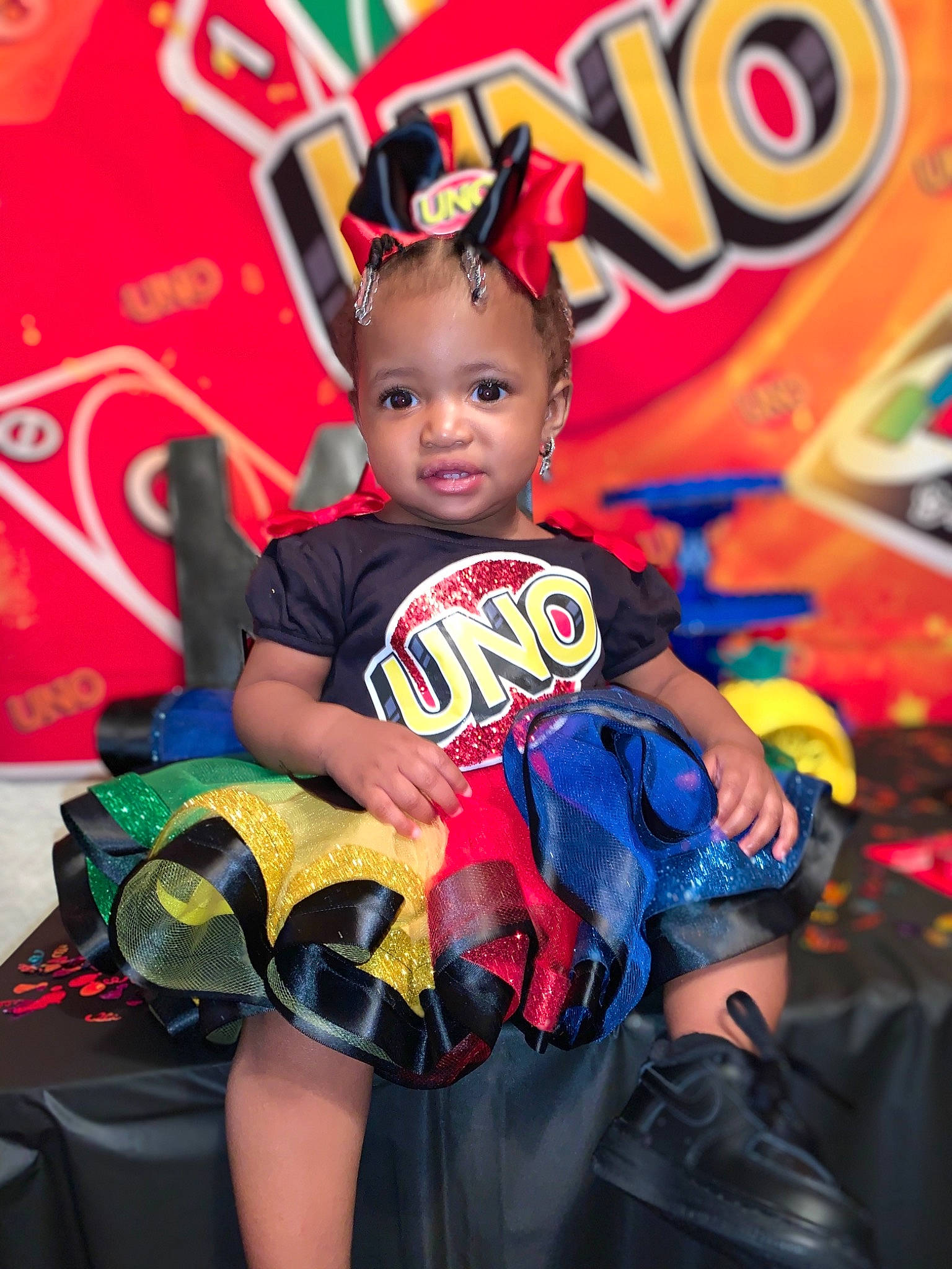 Kamirah joined the competition — help win amazing prizes! baby, baby_toddler_clothing, birthday, child, costume, entertainment, event, fictional_character, fun, happy, leisure, logo, magenta, party, person, personal_protective_equipment, recreation, shoe, sitting, t_shirt