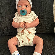 Rosalina joined the competition — help win amazing prizes! baby, infant, pacifier, headband, bow, onesie, giraffe_pattern, socks, converse, sitting, couch, dark_background, cute, small_hands, big_eyes, clothing, footwear, indoor, portrait, child