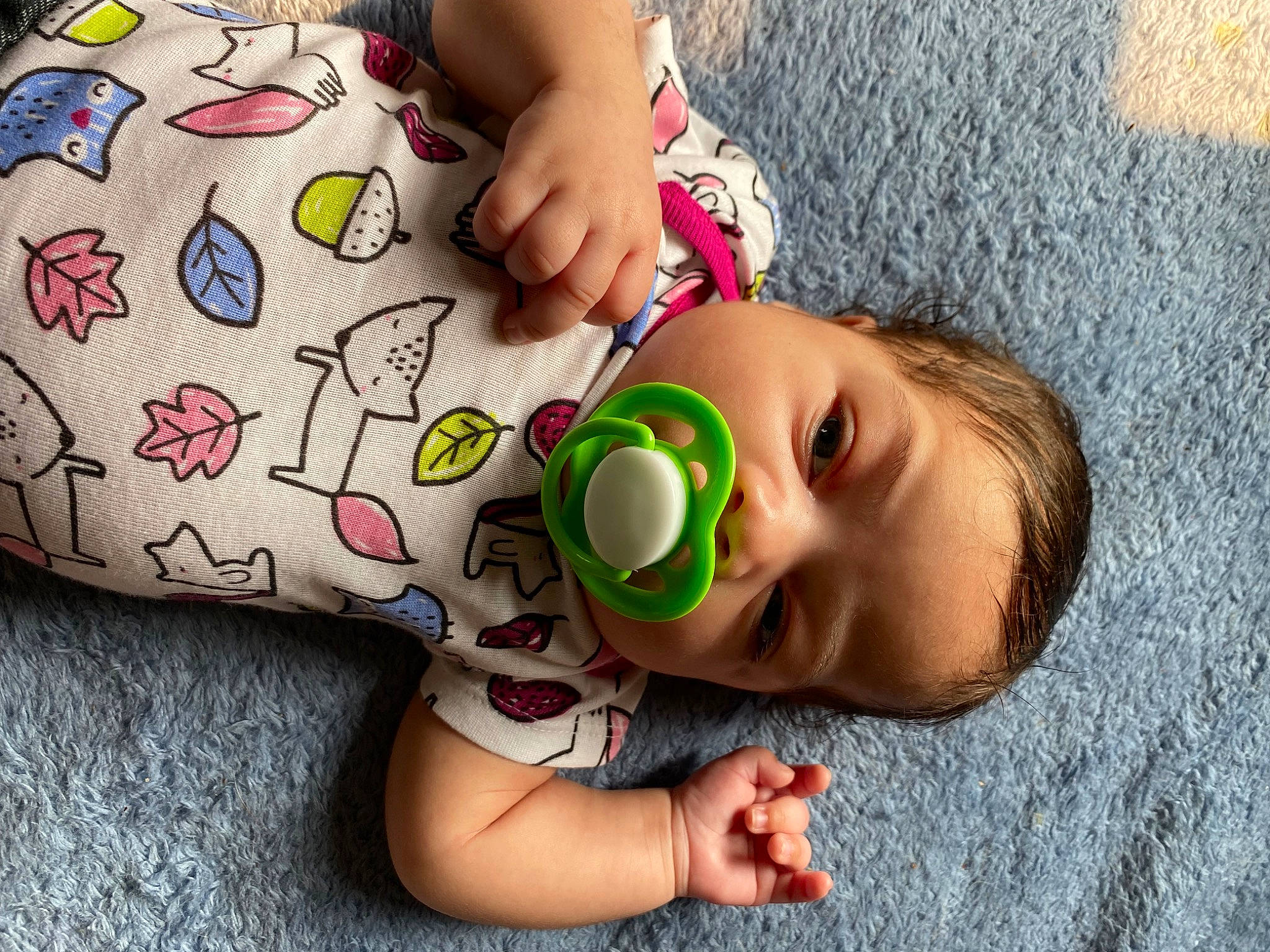 Brielle is registered to the contest to win money with this photo: arm, baby, baby_toddler_clothing, cheek, child, eyelash, finger, flooring, hand, happy, joint, mouth, nail, nose, organ, person, skin, textile, toddler, toy