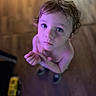 Greyson joined the competition — help win amazing prizes! barefoot, blue_eyes, child, closeup, curly_hair, expression, floor, hands, indoor, looking_up, person, portrait, purple_light, shoes, skin, standing, toddler, toy_truck, wooden_floor, young_child