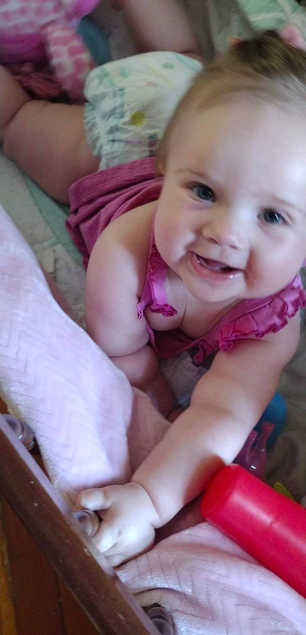 Harleigh joined the competition — help win amazing prizes! baby, baby_toddler_clothing, cheek, chin, comfort, eye, finger, gesture, happy, head, iris, lip, mouth, nose, person, pink, skin, smile, thumb, toddler