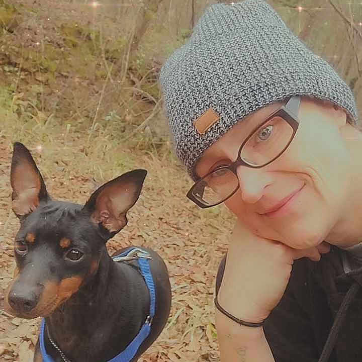 Kiya Jean is registered to the contest to win money with this photo: accessories, animal, canine, cap, clothing, dog, face, glasses, hat, head, land, nature, outdoors, person, photography, plant, portrait, tree, vegetation, woodland