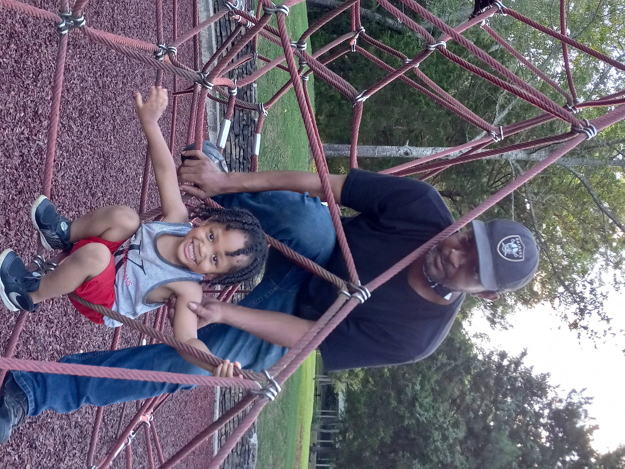 Paul joined the competition — help win amazing prizes! adventure, climbing_harness, fun, grass, hat, headwear, joy, jungle, leisure, outdoor_play_equipment, person, plant, recreation, rope, shorts, sky, smile, swing, tree