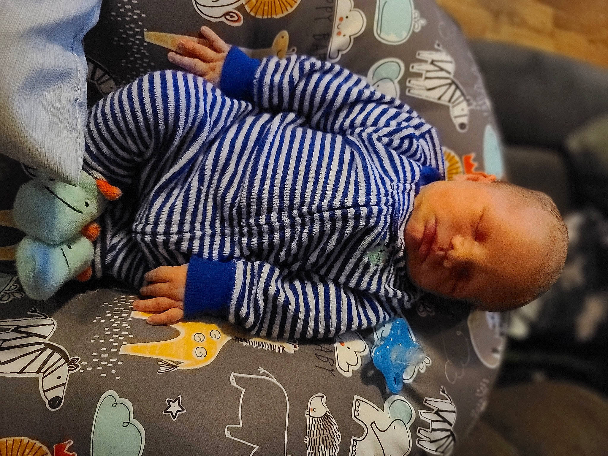 Leyton is registered to the contest to win money with this photo: art, baby, baby_products, carmine, child, comfort, finger, fun, hand, lap, linens, nail, nap, pattern, person, play, room, sitting, suit, textile