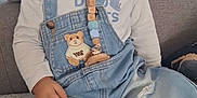 Paolo Greco a rejoint le concours — aidez-le/la à gagner de superbes lots ! toddler, child, pacifier, denim_overalls, curly_hair, sitting, couch, indoors, cute, clothing, face, blue_eyes, patch, hand, car_socks, happy, baby, comfort, smile, young_child