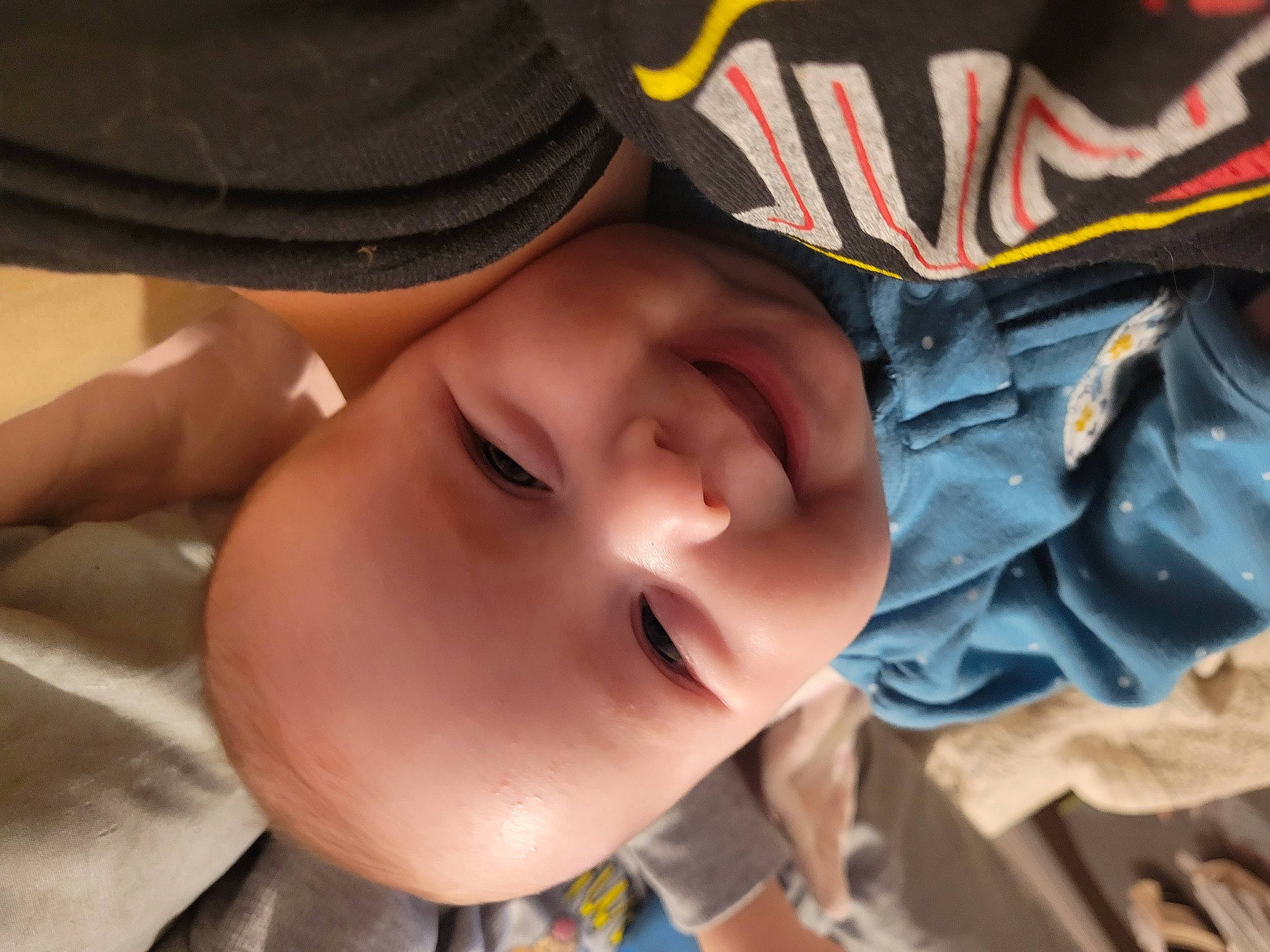 Daenerys is registered to the contest to win money with this photo: baby, baby_toddler_clothing, cap, carmine, cheek, chest, child, eyelash, fashion_accessory, fun, grass, happy, hat, headgear, joy, leisure, lip, nose, person, personal_protective_equipment