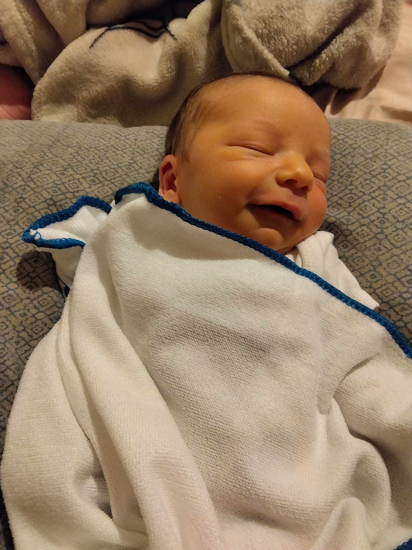 Jaxson joined the competition — help win amazing prizes! newborn, baby, blanket, sleeping, smiling, face, child, infant, soft, cozy, pillow, pattern, bed, resting, wrapped, cute, peaceful, indoors, fabric, comfort
