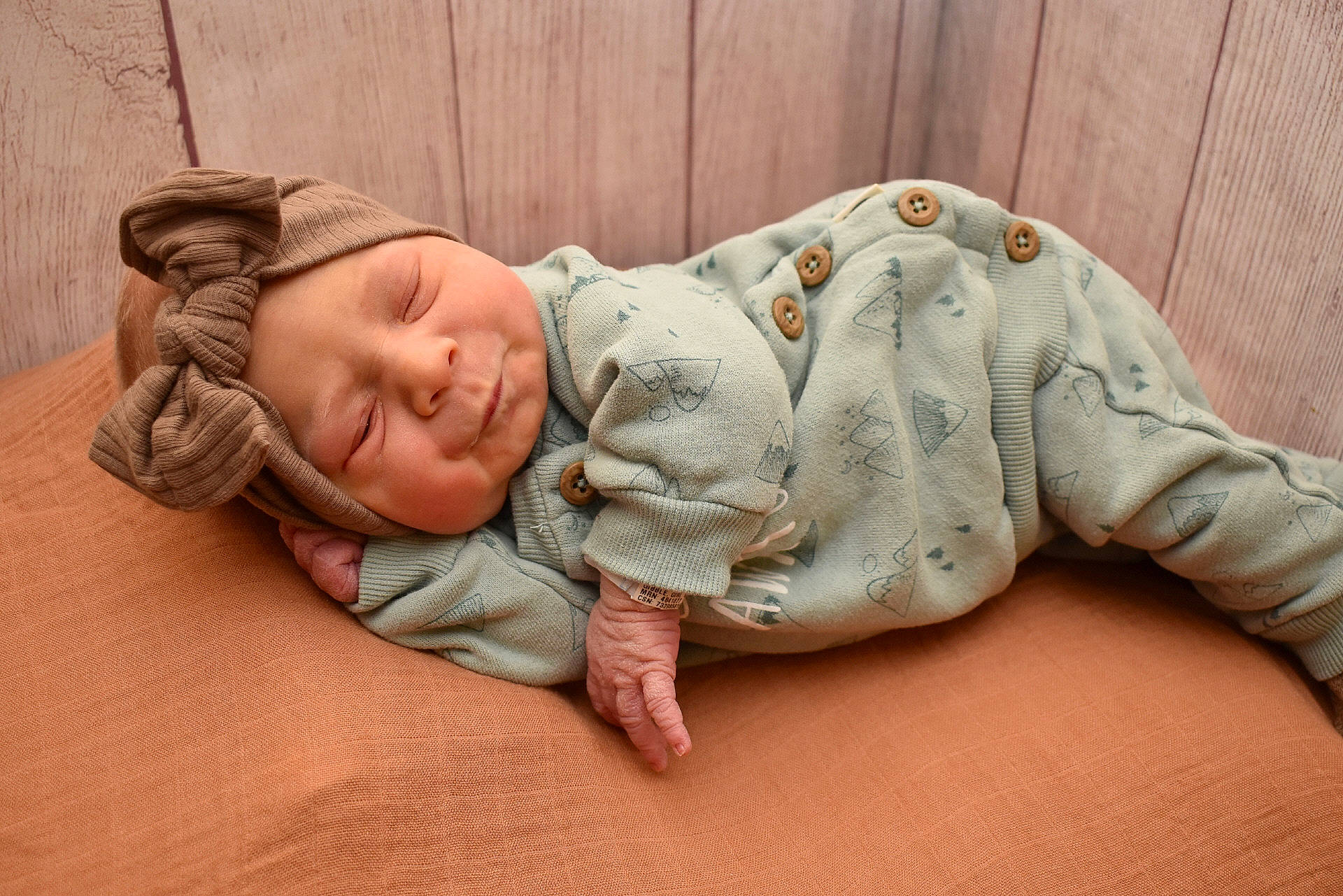 Sadie is registered to the contest to win money with this photo: baby, baby_toddler_clothing, bedding, bedtime, child, comfort, flooring, fur, grass, happy, headgear, headwear, linens, mammal, nap, person, sitting, skin, sleep, toddler