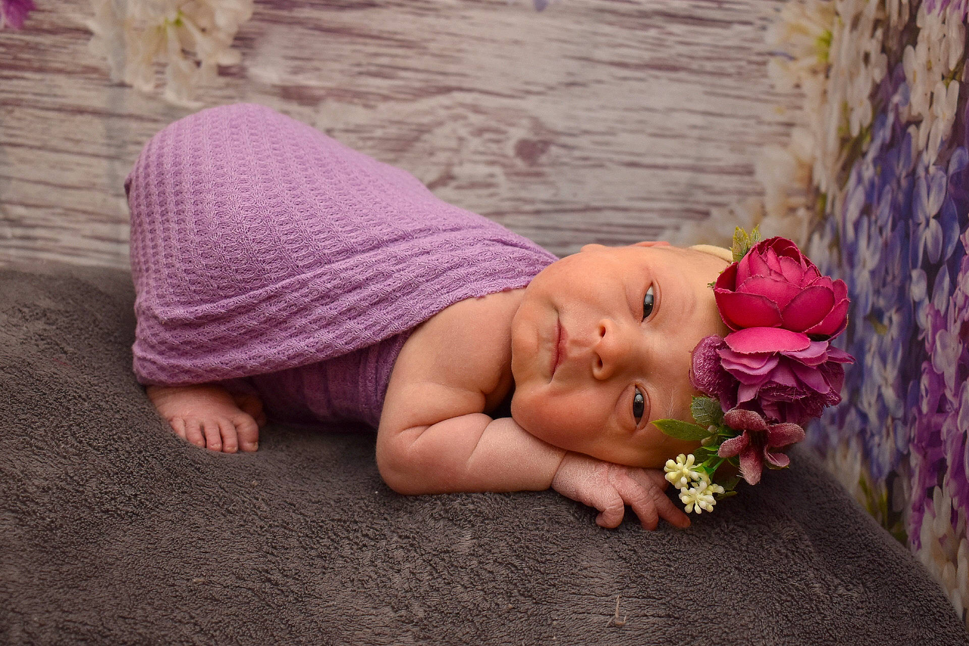 Sadie is registered to the contest to win money with this photo: baby, child, fashion_accessory, flash_photography, flower, grass, happy, headgear, headpiece, headwear, jewellery, magenta, people_in_nature, person, petal, pink, plant, rose_family, sitting, skin