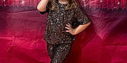 Sneaux is registered to the contest to win money with this photo: accessories, adult, clothing, face, female, formalwear, happy, head, hosiery, jewelry, lady, pants, person, photobooth, sleeve, smile, sock, standing, suit, woman