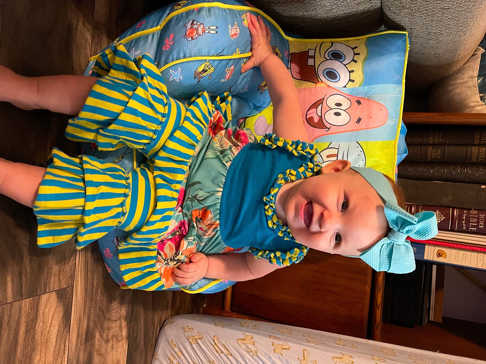 Winona is registered to the contest to win money with this photo: baby, baby_products, baby_toddler_clothing, child, fun, happy, hat, head, headgear, headwear, joy, leisure, pattern, person, play, room, sleeve, toddler, wood