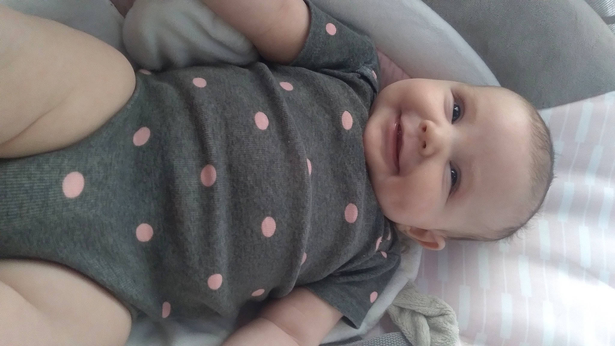 Riverlynn is registered to the contest to win money with this photo: arm, baby, baby_products, baby_toddler_clothing, cheek, child, comfort, eye, finger, hand, head, joy, lip, nail, pattern, person, product, skin, sleeve, smile