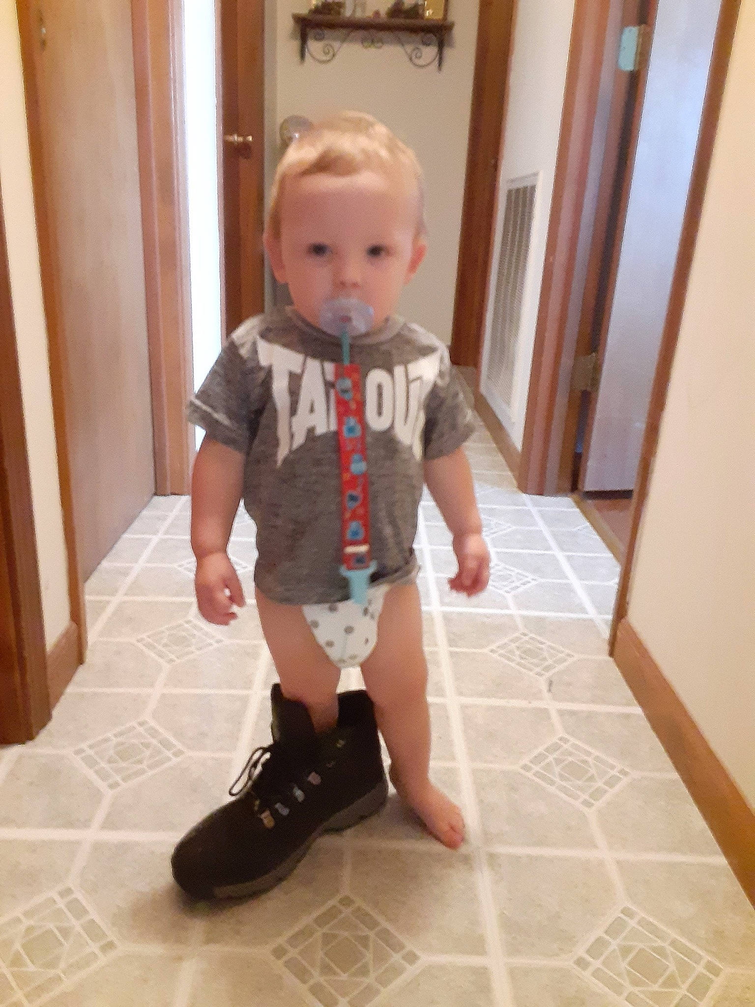 Paxton joined the competition — help win amazing prizes! baby, baby_toddler_clothing, calf, door, fashion_design, floor, flooring, foot, hardwood, human_leg, knee, leg, pattern, person, skin, sleeve, thigh, toddler, trunk, waist