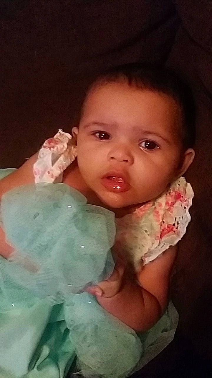 Kiana is registered to the contest to win money with this photo: baby, cheek, child, ear, eye, face, facial_expression, fun, head, iris, lip, mouth, nose, person, pink, skin, smile, toddler