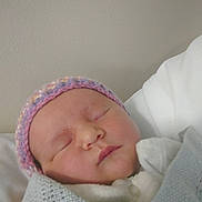 Arabella joined the competition — help win amazing prizes! newborn, baby, sleeping, blanket, hat, knitted, infant, face, peaceful, closeup, wrapped, soft, indoors, person, headwear, cute, portrait, child, resting, warm