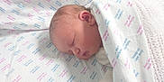 Arabella is registered to the contest to win money with this photo: newborn, baby, sleeping, blanket, hospital, infant, swaddled, bed, soft, peaceful, cute, face, head, skin, clothing, young, resting, healthcare, comfort, indoors