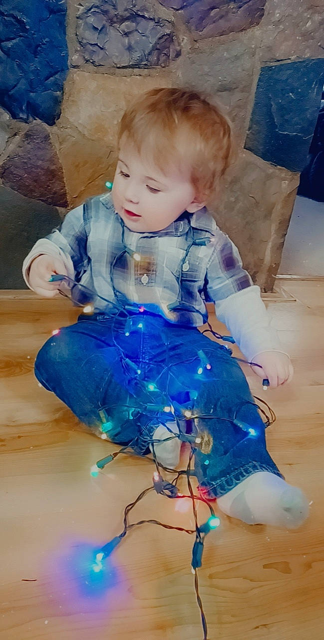 Bryce is registered to the contest to win money with this photo: art, baby, baby_products, baby_toddler_clothing, ball, blue, child, dress, electric_blue, fashion_accessory, flooring, fun, happy, human_leg, iris, pattern, person, play, sitting, sleeve