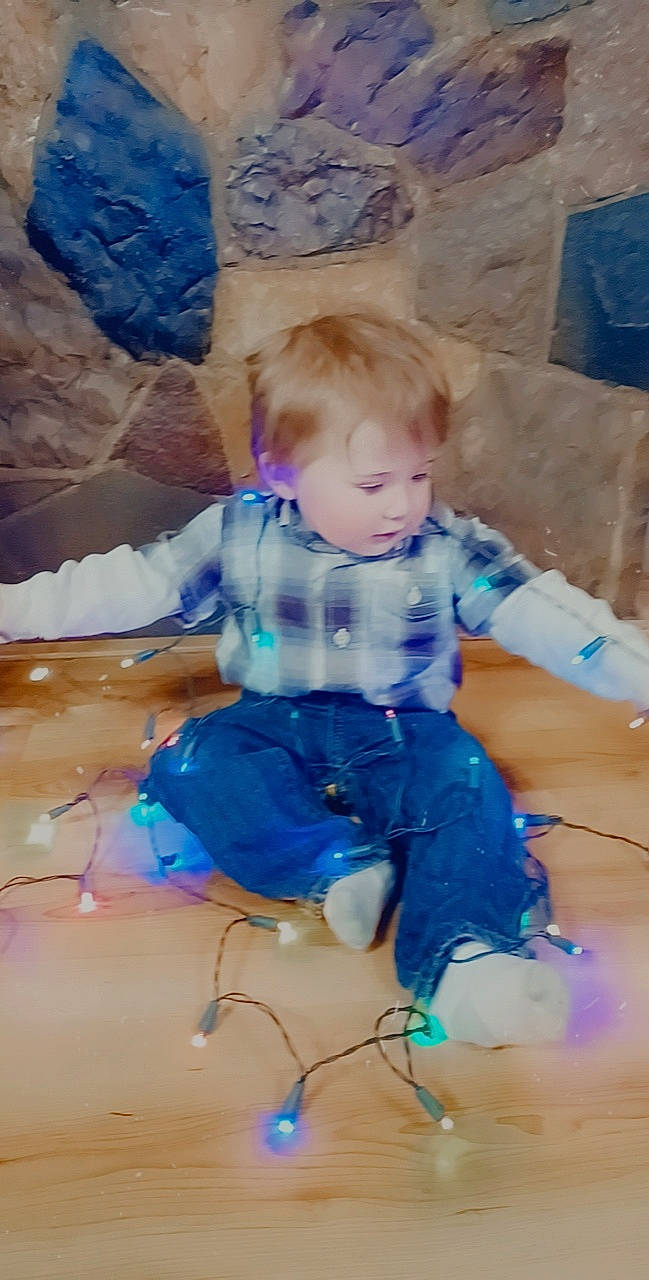 Bryce is registered to the contest to win money with this photo: abdomen, baby, baby_toddler_clothing, child, comfort, electric_blue, fun, happy, human_leg, knee, lap, leisure, paint, pattern, person, play, sitting, t_shirt, thigh, toddler