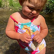 Juliet joined the competition — help win amazing prizes! toddler, child, water, stream, swimsuit, pigtails, outdoor, nature, sunlight, grass, barefoot, cute, summer, playful, baby, person, skin, happy, young_child, sunny