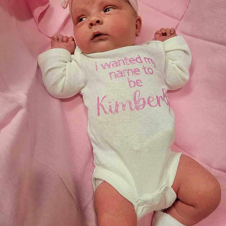 Raylee is registered to the contest to win money with this photo: baby, bed, blanket, bodypart, clothing, couch, cushion, diaper, face, furniture, glove, hat, head, homedecor, newborn, person, photography, portrait, sleeve, t_shirt
