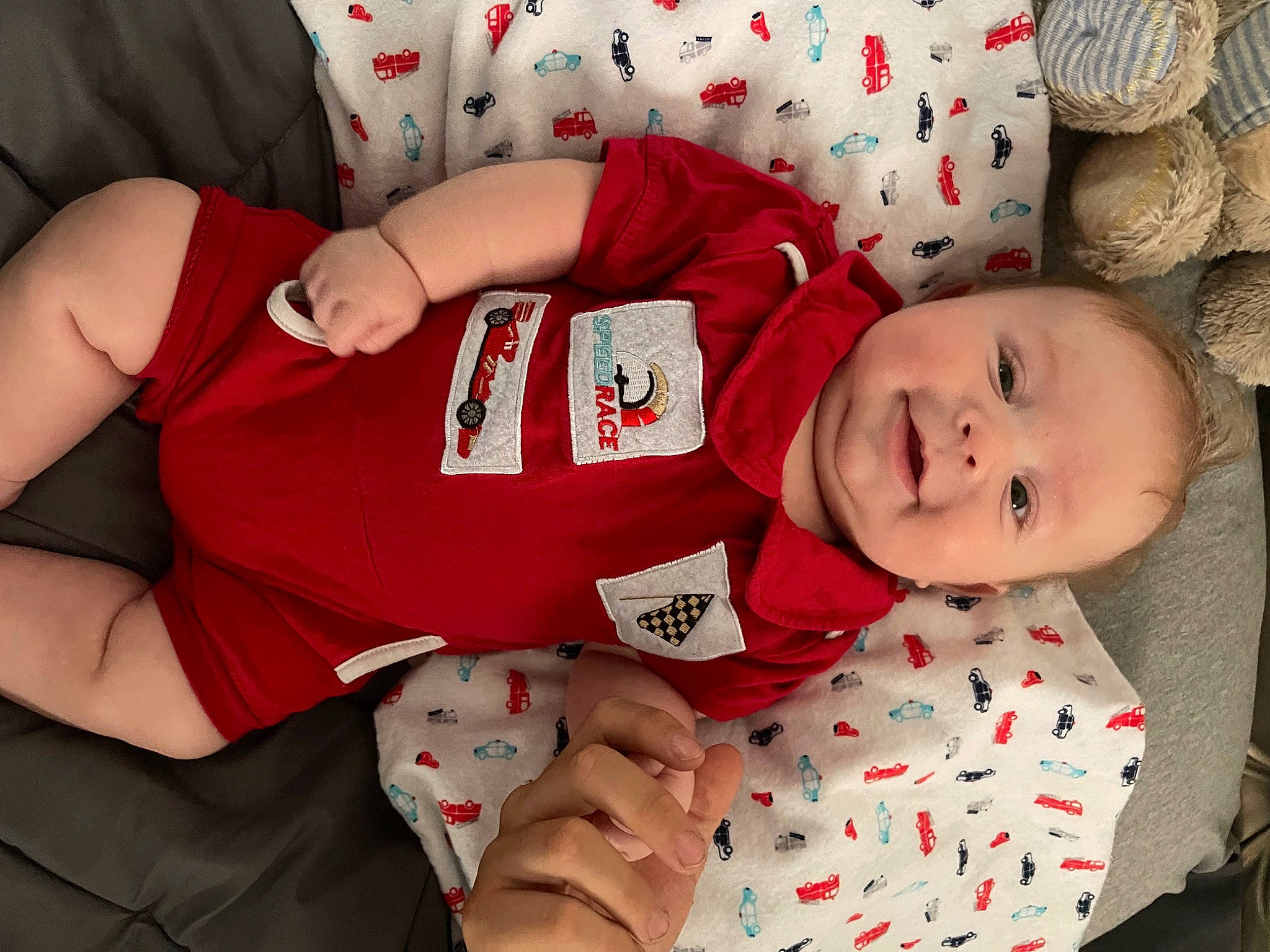 Rylan is registered to the contest to win money with this photo: baby, baby_toddler_clothing, carmine, child, comfort, elbow, event, face, happy, head, holiday, lap, pattern, person, red, sitting, sleeve, smile, thigh, toddler