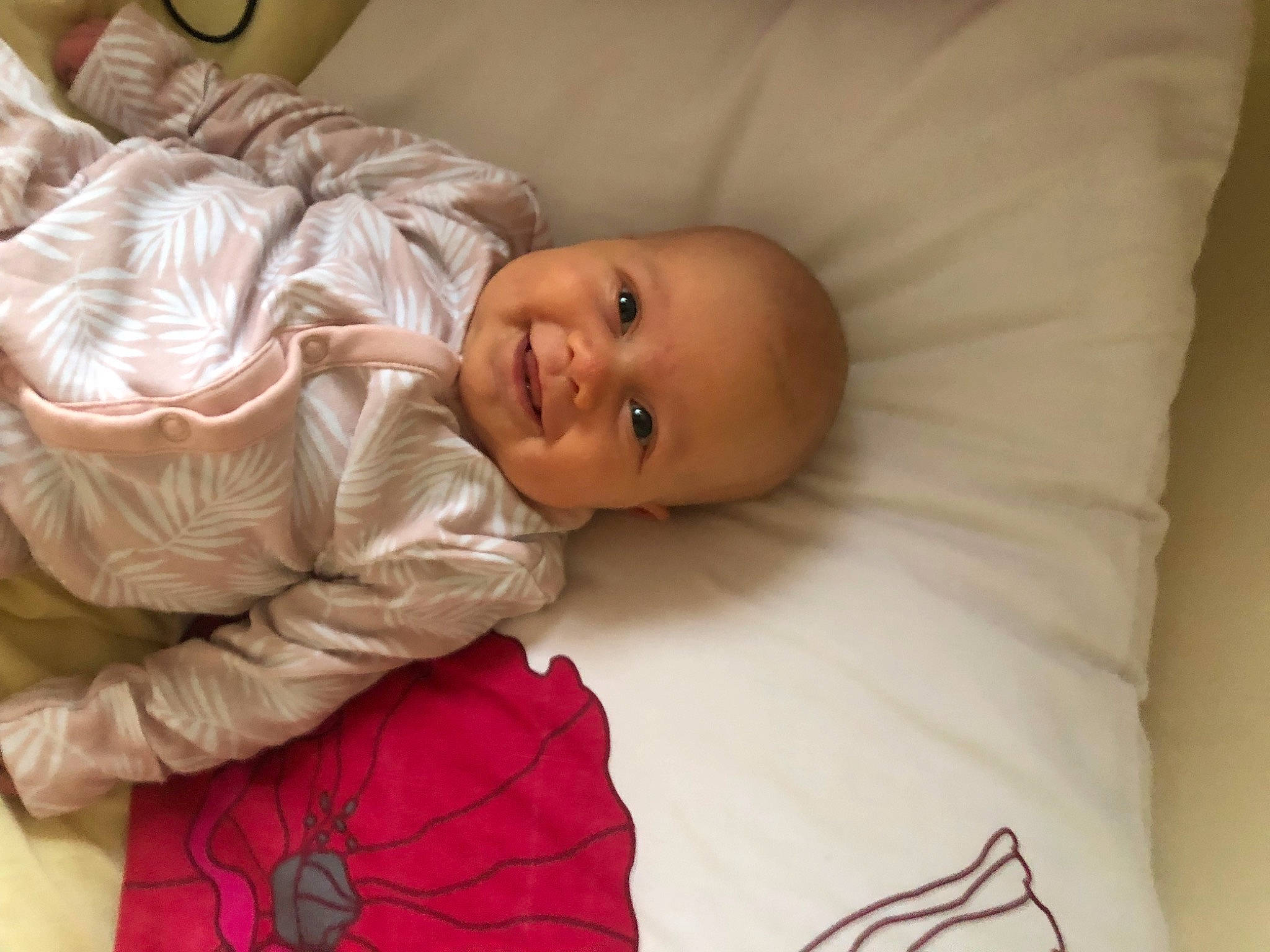 Esme is registered to the contest to win money with this photo: baby, baby_laughing, baby_products, baby_toddler_clothing, cheek, child, comfort, eye, happy, head, iris, joy, laugh, linens, person, portrait_photography, room, skin, sleep, sleeve
