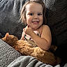 animal, blanket, cat, child, clothing, couch, cozy, cute, face, friendship, hair, happy, home, indoor, orange_cat, pet, relaxing, smile, texture, toddler