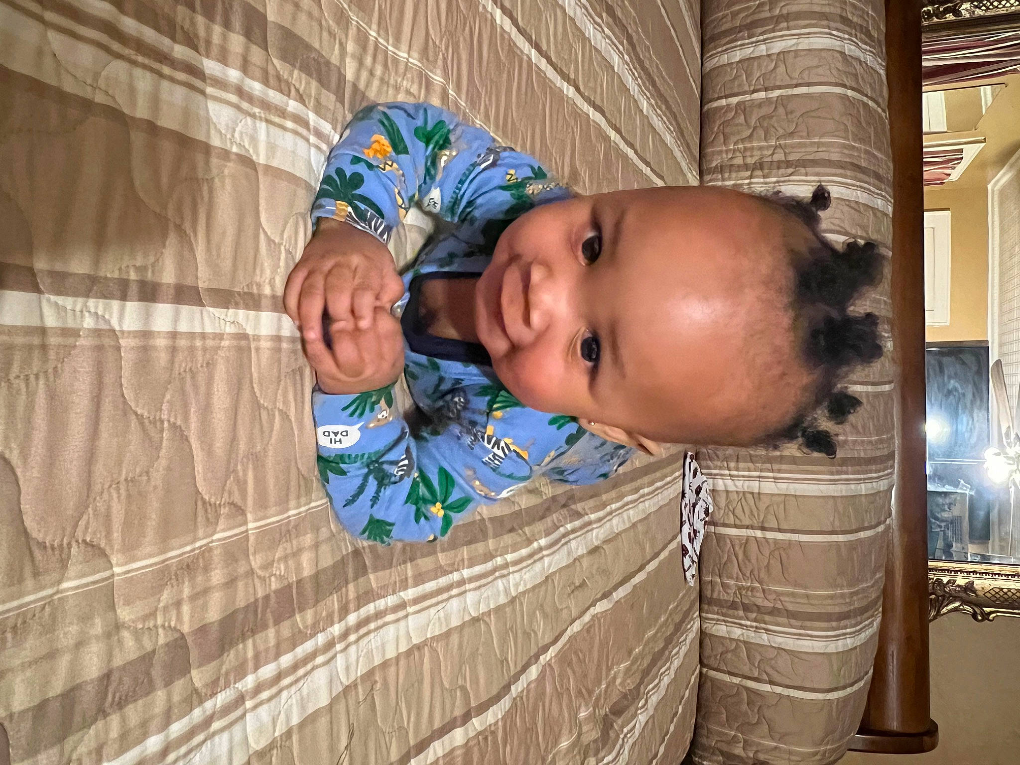 Jaiden is registered to the contest to win money with this photo: baby, baby_toddler_clothing, child, electric_blue, flooring, fun, happy, head, pattern, person, room, sitting, smile, toddler, wood