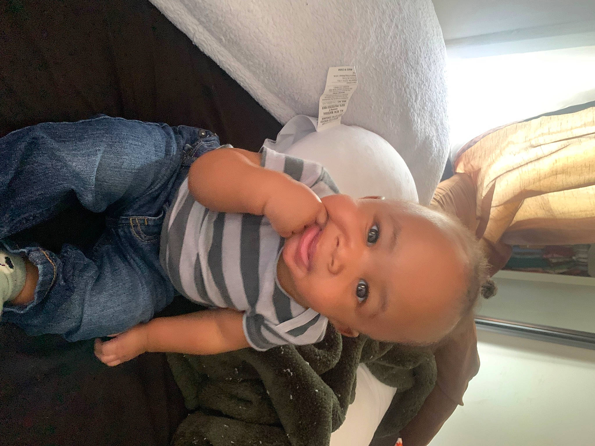 Jordan is registered to the contest to win money with this photo: abdomen, baby, baby_products, chair, chest, child, comfort, elbow, fun, happy, hat, human_leg, mouth, nose, person, room, sitting, smile, t_shirt, toddler