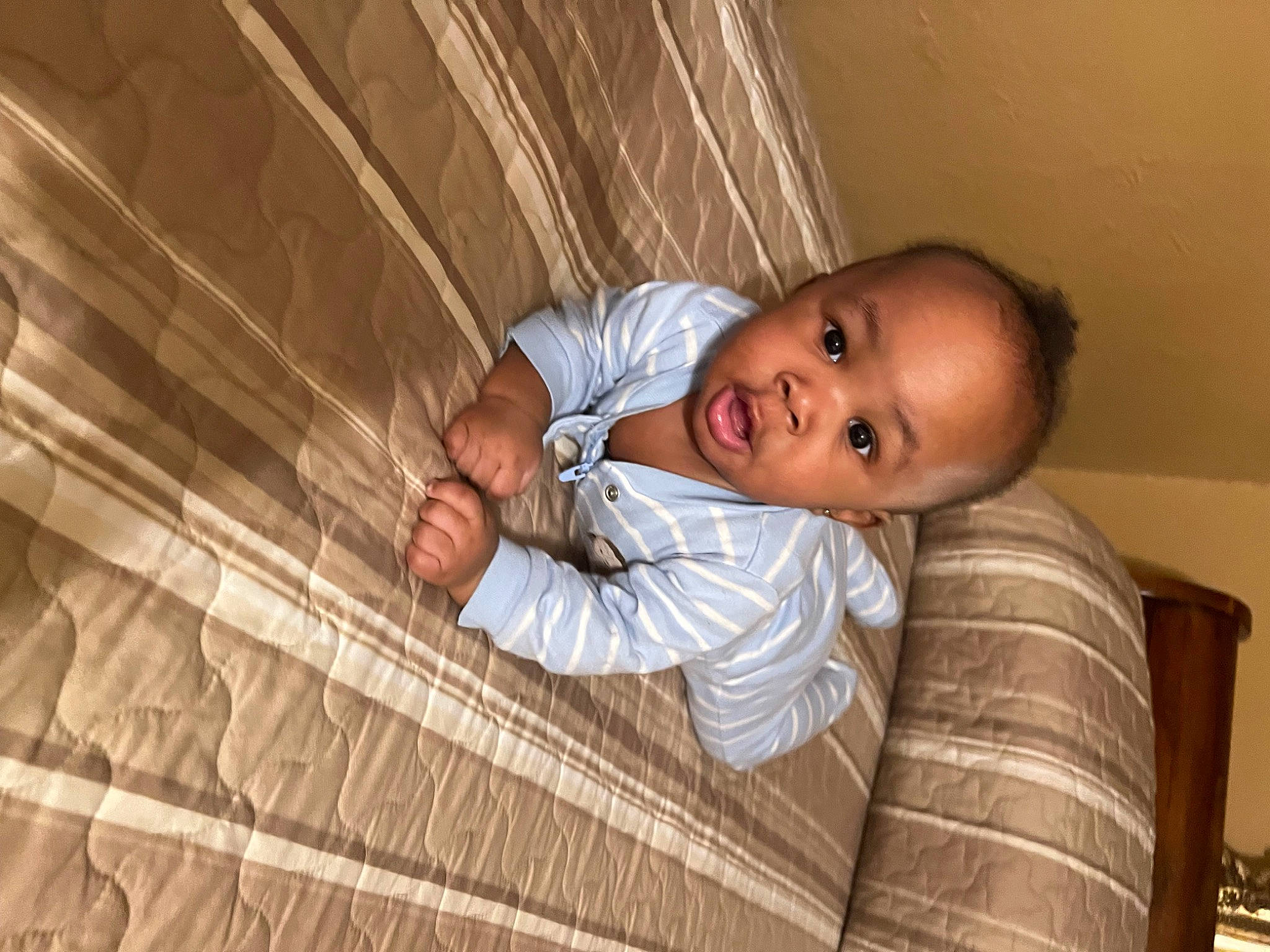 Jordan is registered to the contest to win money with this photo: baby, baby_products, baby_toddler_clothing, ceiling, child, comfort, flooring, fun, happy, hardwood, pattern, person, room, sitting, smile, toddler, wood