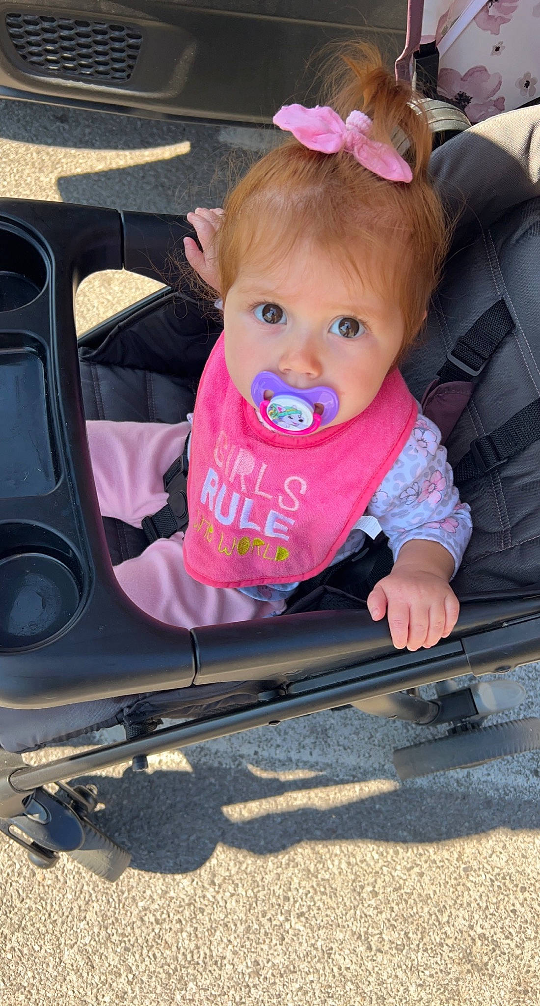 Ivanna is registered to the contest to win money with this photo: automotive_exterior, baby, baby_carriage, baby_products, baby_toddler_clothing, beauty, chair, cheek, child, fender, fun, grass, iris, motor_vehicle, person, pink, snapshot, toddler, vehicle, white