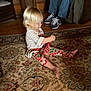 Kenzie is registered to the contest to win money with this photo: baby, child, christmas, christmas_eve, dress, family, floor, flooring, fun, holiday, leg, people, play, room, sitting, smile, toddler, vacation, wood