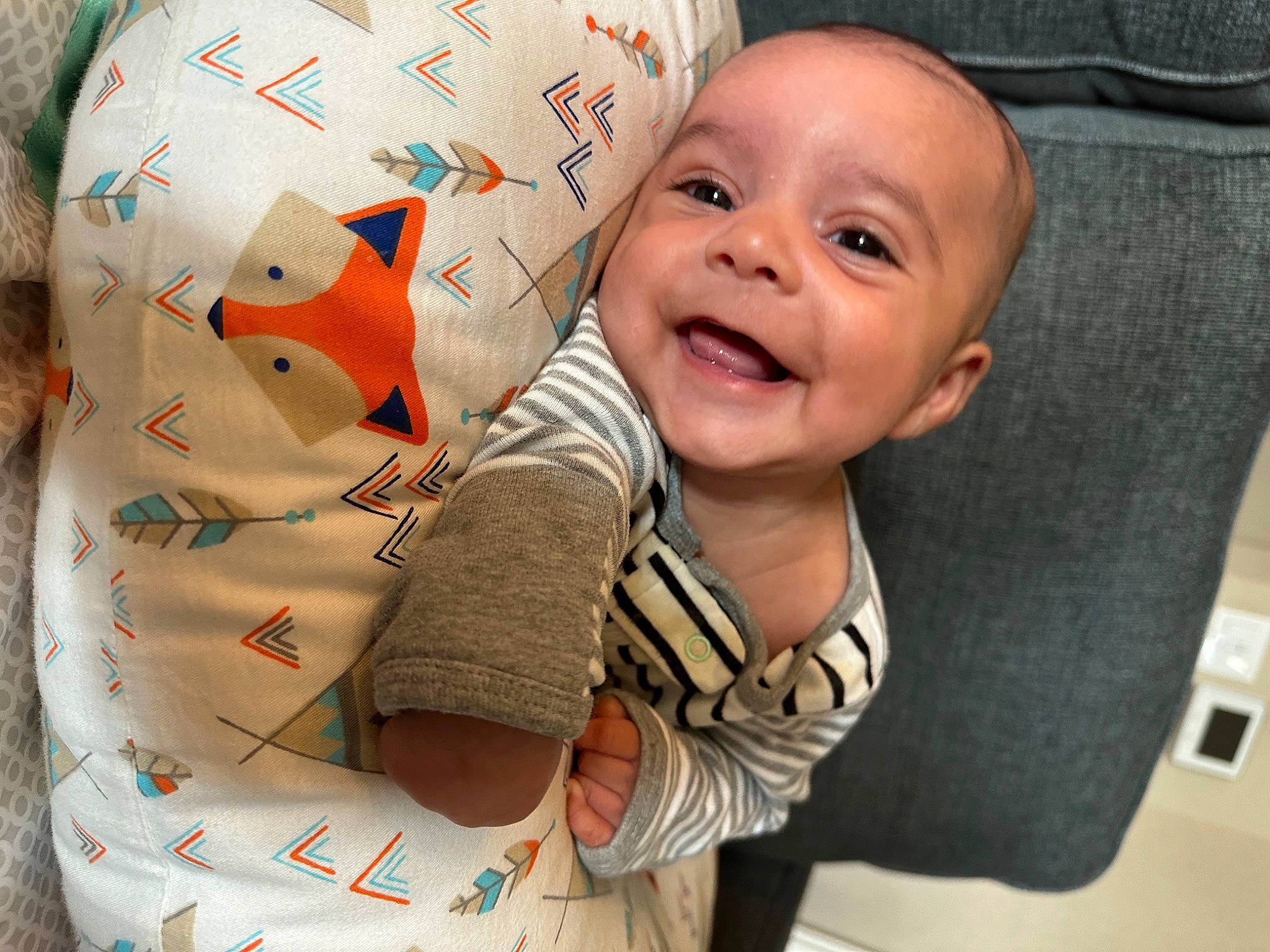 Caleb joined the competition — help win amazing prizes! baby, baby_laughing, baby_toddler_clothing, carmine, cheek, child, comfort, finger, fun, happy, joy, laugh, linens, pattern, person, room, sitting, sleeve, smile, t_shirt