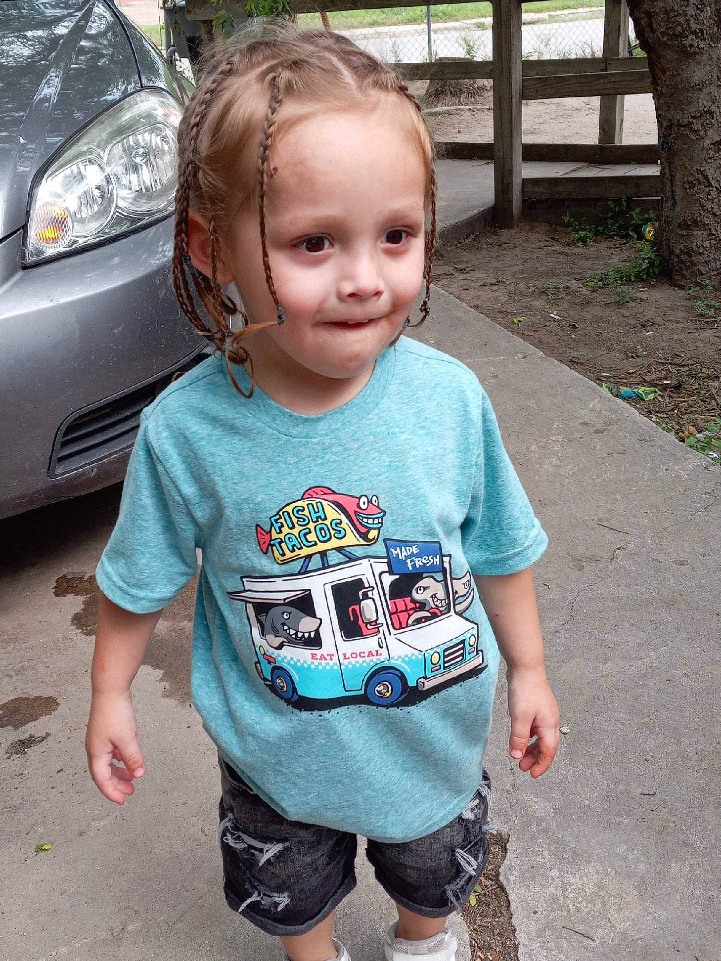 Dallas is registered to the contest to win money with this photo: automotive_lighting, automotive_tire, baby_toddler_clothing, cool, grass, grille, hair, happy, hood, leisure, mammal, mouth, person, photograph, plant, shoulder, sleeve, smile, tree, vehicle_door