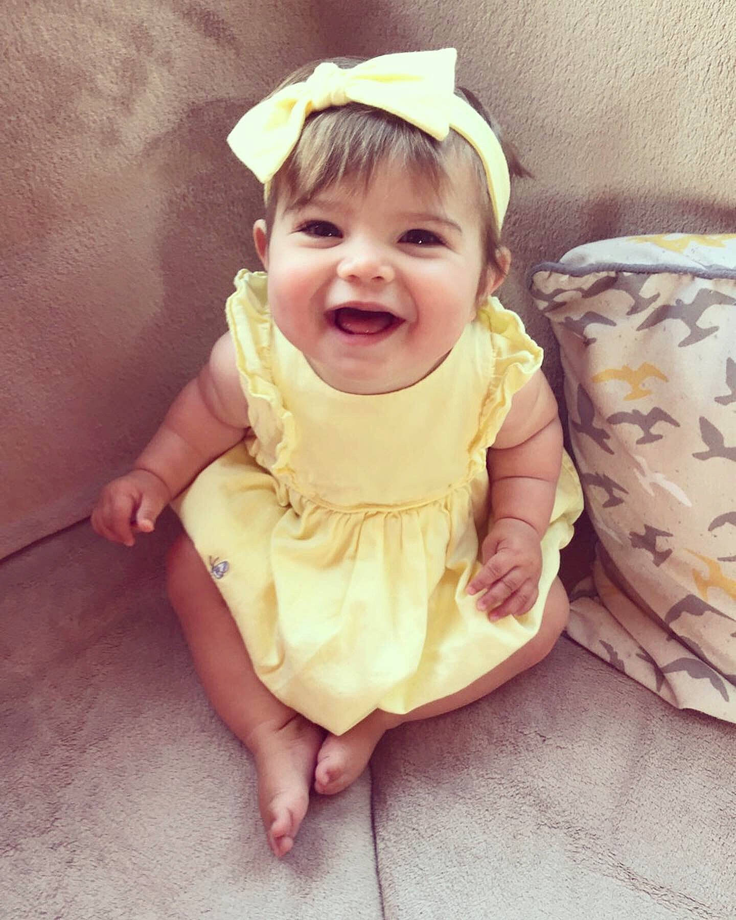 úna is registered to the contest to win money with this photo: baby, baby_laughing, baby_toddler_clothing, beauty, cheek, child, dress, eye, face, facial_expression, happy, head, headgear, laugh, mouth, person, play, skin, smile, toddler