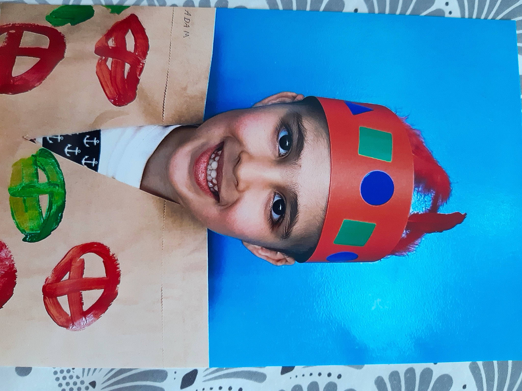 Adam participe au concours pour gagner de l'argent avec cette photo : advertising, art, carmine, child, circle, electric_blue, font, graphic_design, graphics, happy, headwear, joy, logo, paper, paper_product, pattern, person, photograph, rectangle, red