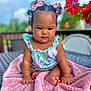 Alaina joined the competition — help win amazing prizes! baby, child, pink_bow, curly_hair, floral_dress, blanket, outdoor, table, flower, red_flower, greenery, cute, portrait, infant, hands, feet, summer, garden, soft_texture, sitting