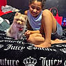 accessory, animal, bed, blanket, casual, child, clothing, cute, dog, furniture, girl, hair, happy, indoor, pet, portrait, relaxed, room, smiling, young